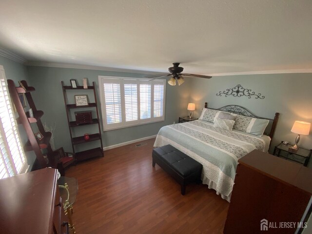 bedroom with crown molding, ceiling fan, and hardwood / wood-style floors