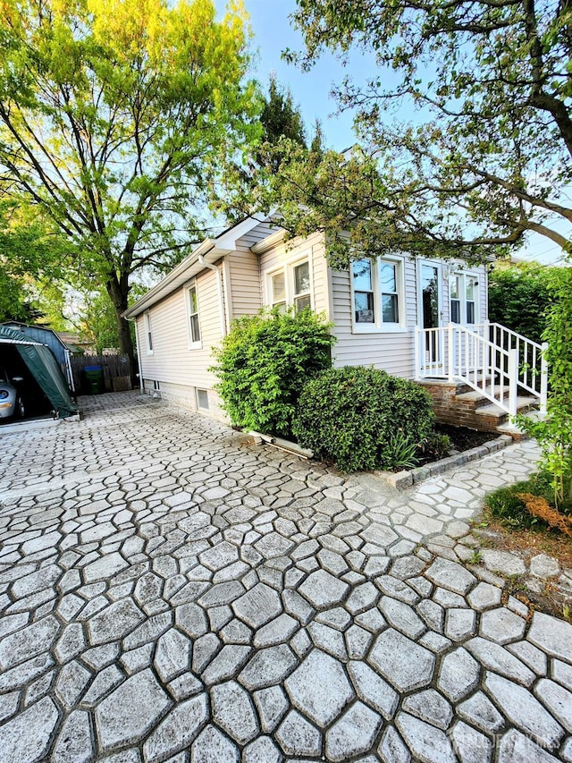 11 Melbourne St, Edison, NJ 08817 - view of side of property with decorative driveway