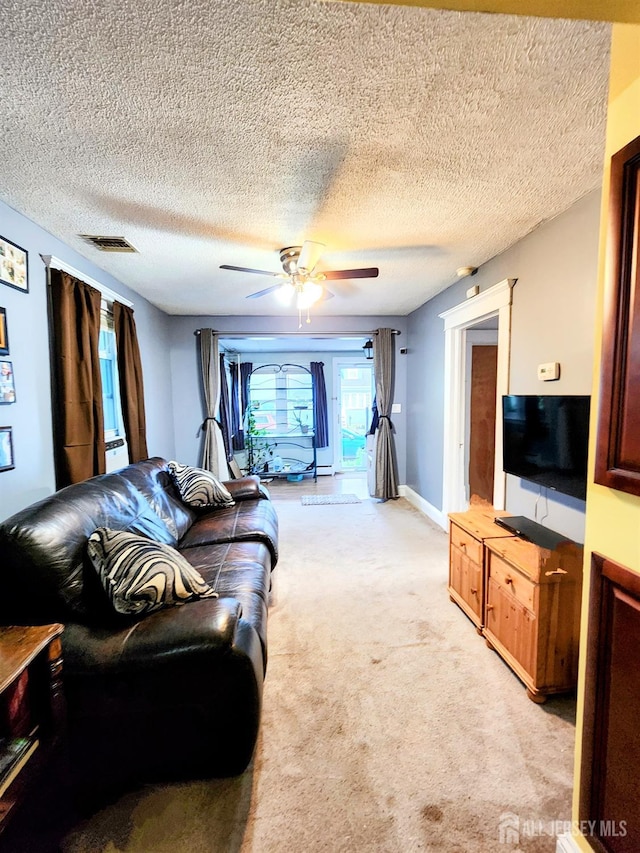 11 Melbourne St, Edison, NJ 08817 - living room with light colored carpet, ceiling fan, and a textured ceiling