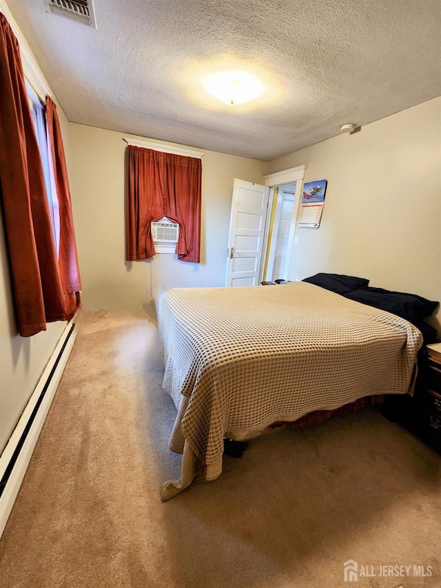 11 Melbourne St, Edison, NJ 08817 - bedroom with a baseboard radiator, carpet floors, a textured ceiling, and cooling unit