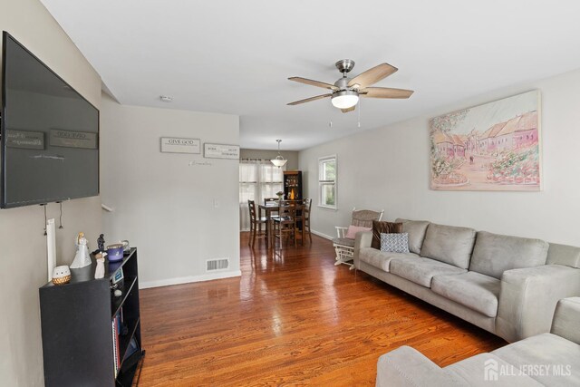 315 D St, Middlesex, NJ 08846 - living area featuring ceiling fan, wood finished floors, and baseboards