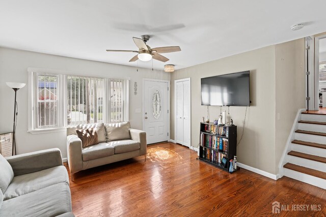 315 D St, Middlesex, NJ 08846 - living room with a ceiling fan, wood finished floors, stairs, and baseboards