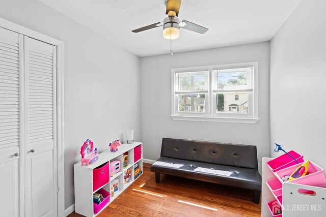 315 D St, Middlesex, NJ 08846 - recreation room featuring wood finished floors, a ceiling fan, and baseboards