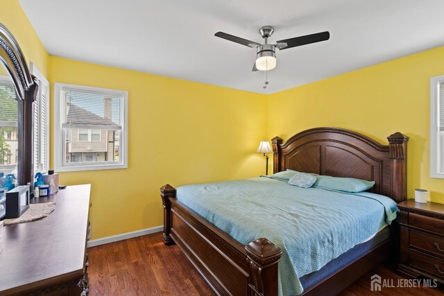 315 D St, Middlesex, NJ 08846 - bedroom featuring multiple windows, dark wood-type flooring, baseboards, and ceiling fan