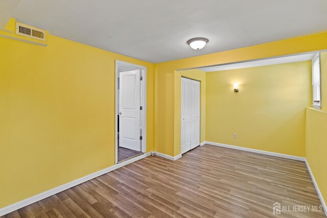 315 D St, Middlesex, NJ 08846 - empty room with baseboards and wood finished floors