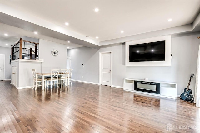 18 Rosewood Rd, Edison, NJ 08817 - living room with wood finished floors, recessed lighting, and a glass covered fireplace