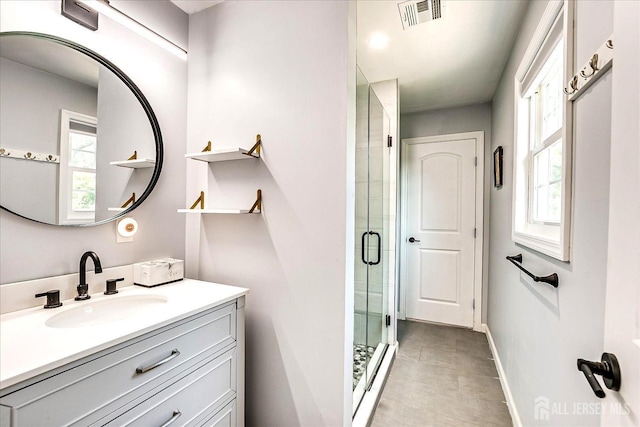 18 Rosewood Rd, Edison, NJ 08817 - full bath with vanity, a shower stall, healthy amount of natural light, and tile patterned flooring