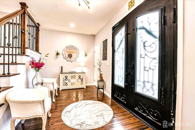 18 Rosewood Rd, Edison, NJ 08817 - entrance foyer with french doors, stairs, and wood finished floors