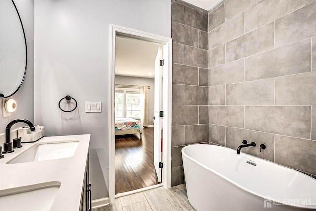 18 Rosewood Rd, Edison, NJ 08817 - full bathroom with wood finished floors, a soaking tub, vanity, and ensuite bathroom