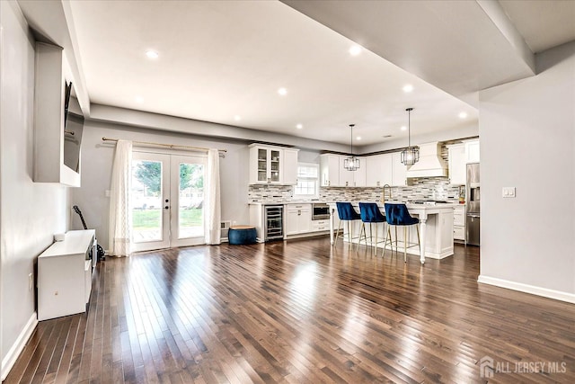 18 Rosewood Rd, Edison, NJ 08817 - living room featuring dark wood-style floors, recessed lighting, french doors, and beverage cooler