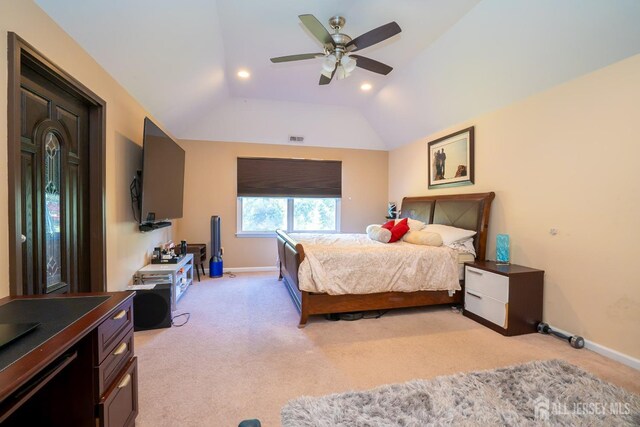 bedroom with lofted ceiling, light carpet, and ceiling fan