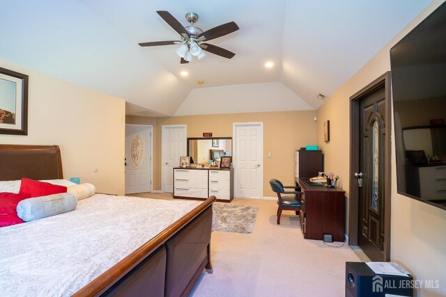 carpeted bedroom featuring vaulted ceiling and ceiling fan