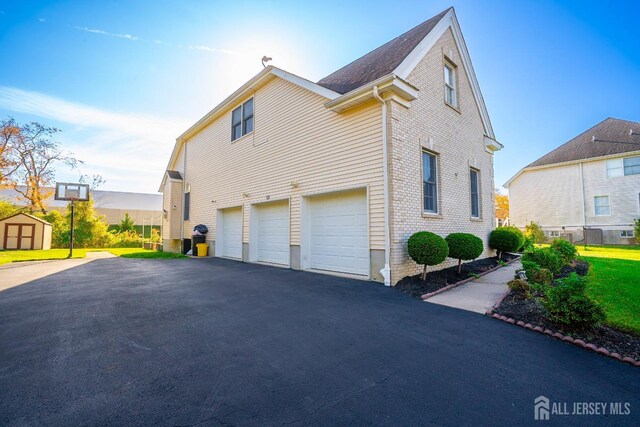 view of side of property featuring a garage