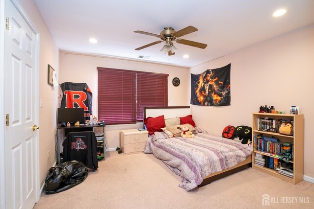 carpeted bedroom featuring ceiling fan