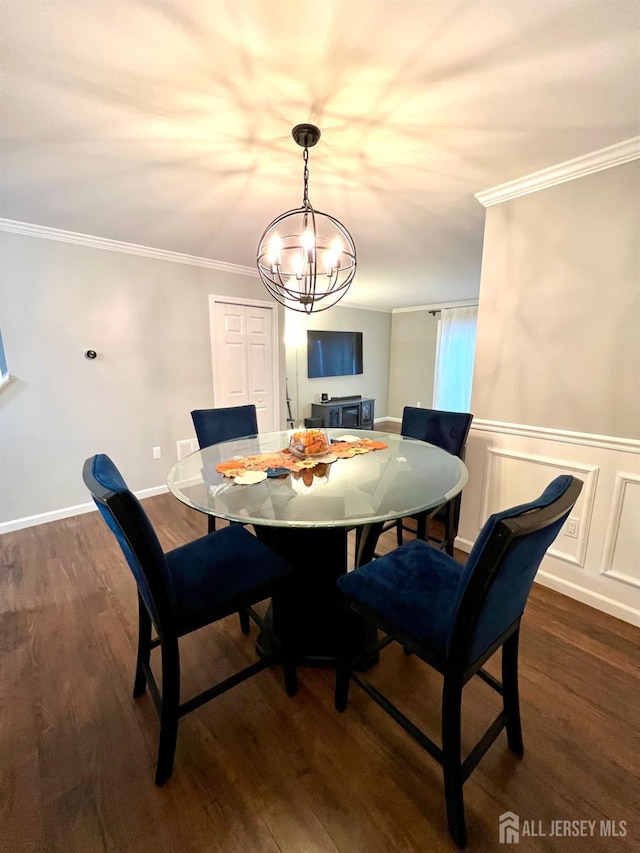 dining area with crown molding and dark hardwood / wood-style flooring