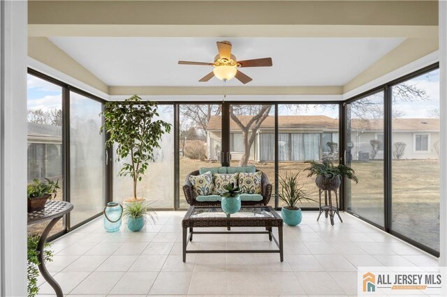 sunroom / solarium with ceiling fan