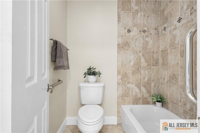 bathroom featuring tile patterned flooring, shower with separate bathtub, and toilet