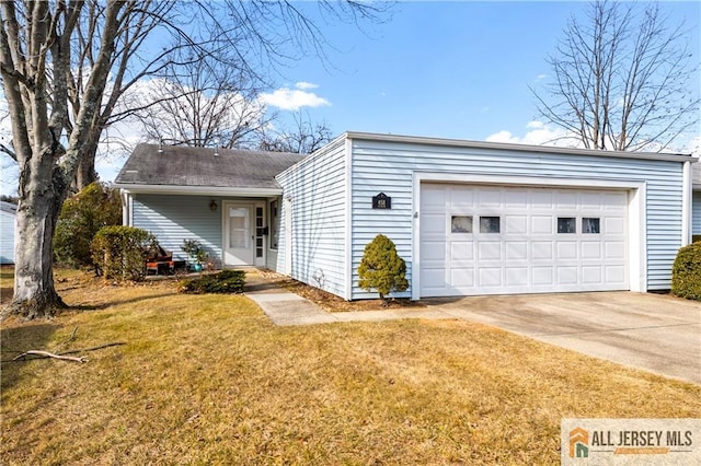 ranch-style home with a garage and a front yard