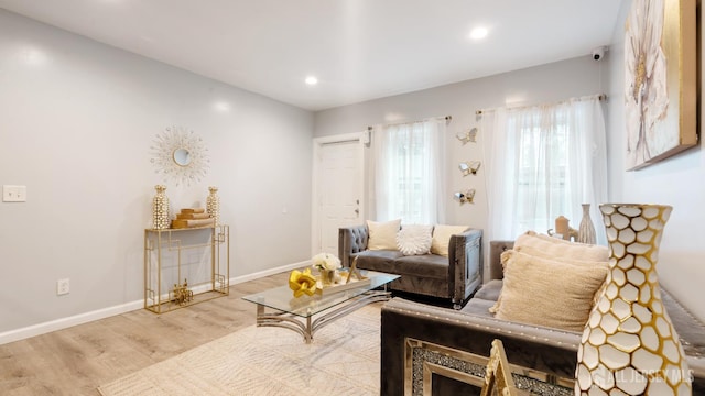 living area featuring wood finished floors, recessed lighting, and baseboards
