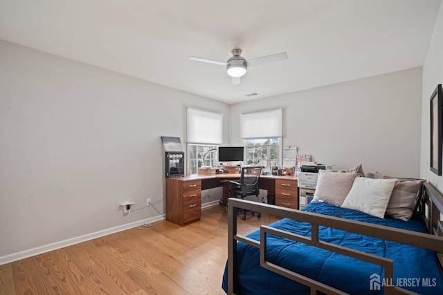 bedroom with visible vents, baseboards, light wood-style floors, and ceiling fan