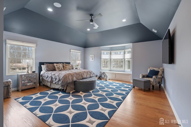 bedroom with vaulted ceiling, a ceiling fan, baseboards, and wood finished floors