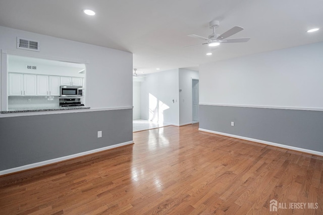 unfurnished living room featuring recessed lighting, a ceiling fan, visible vents, and light wood-type flooring