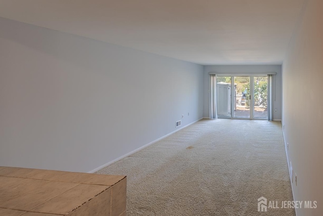 1027 Schmidt Ln, North Brunswick, NJ 08902 - unfurnished room with light carpet and baseboards