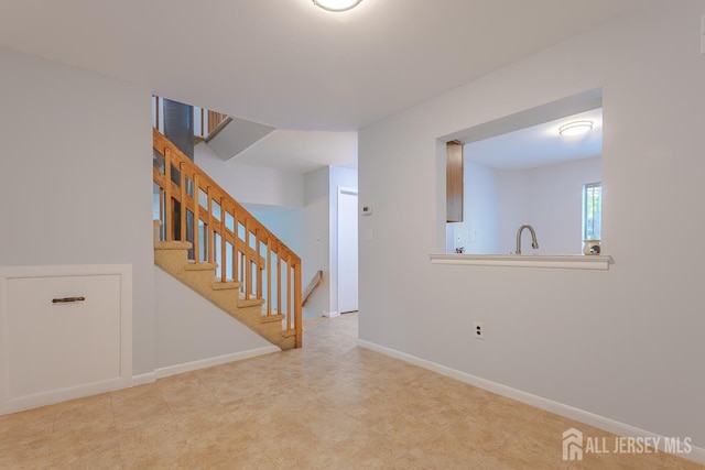 1027 Schmidt Ln, North Brunswick, NJ 08902 - empty room featuring stairway and baseboards