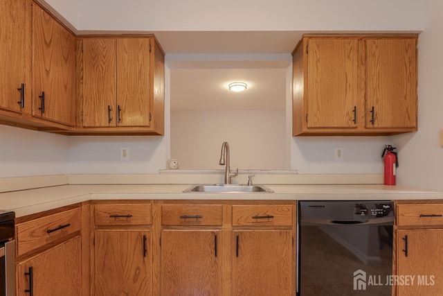 1027 Schmidt Ln, North Brunswick, NJ 08902 - kitchen featuring dishwasher, light countertops, and brown cabinetry