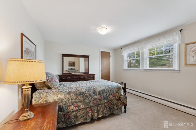 341 Ellis Pkwy, Piscataway, NJ 08854 - bedroom with a baseboard radiator and carpet floors