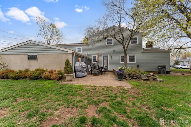 341 Ellis Pkwy, Piscataway, NJ 08854 - back of property featuring a patio area and a yard