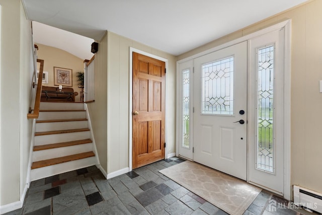 341 Ellis Pkwy, Piscataway, NJ 08854 - foyer with baseboard heating, stone tile flooring, stairs, and baseboards