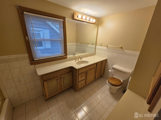 4 Vale St, Edison, NJ 08817 - bathroom with tile walls, tile patterned flooring, vanity, and a wainscoted wall