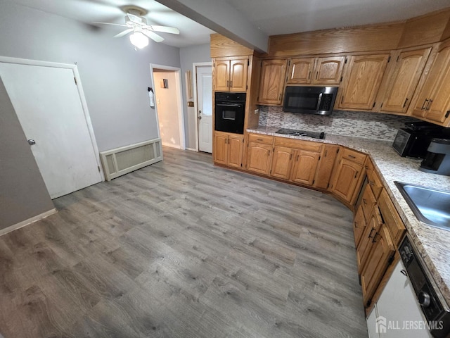 4 Vale St, Edison, NJ 08817 - kitchen featuring black appliances, decorative backsplash, ceiling fan, and light wood finished floors