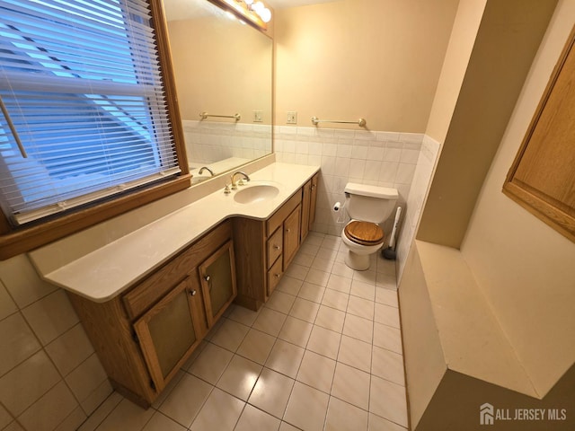 4 Vale St, Edison, NJ 08817 - bathroom with tile patterned flooring, vanity, wainscoting, and tile walls