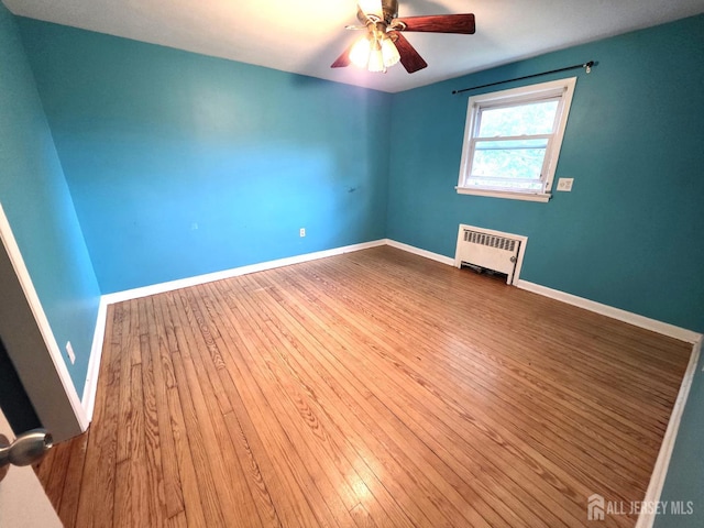 4 Vale St, Edison, NJ 08817 - spare room with radiator, hardwood / wood-style flooring, and a ceiling fan