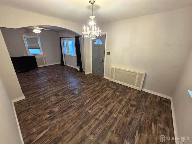 4 Vale St, Edison, NJ 08817 - unfurnished dining area featuring a chandelier, wood finished floors, arched walkways, radiator heating unit, and ceiling fan