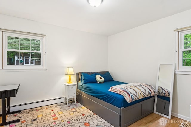 95 Union Ave, Edison, NJ 08820 - bedroom featuring baseboard heating and wood finished floors