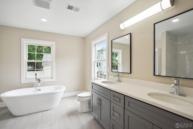 431-431 Garfield Ave, South Plainfield, NJ 07080 - full bath featuring plenty of natural light, double vanity, a marble finish shower, a freestanding bath, and recessed lighting
