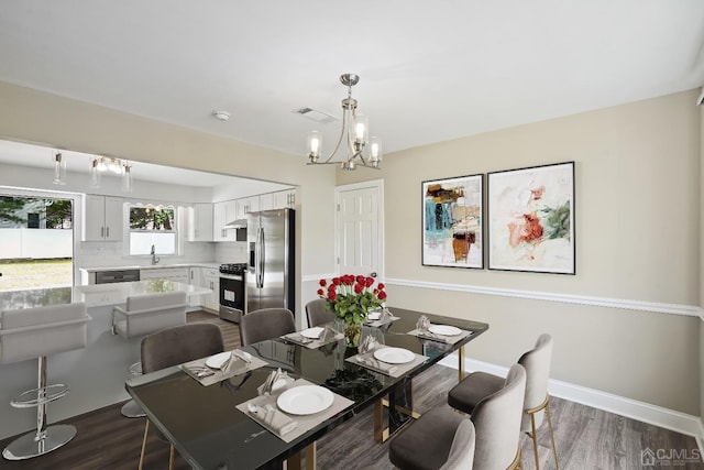 431-431 Garfield Ave, South Plainfield, NJ 07080 - dining area featuring a chandelier and dark wood-style flooring