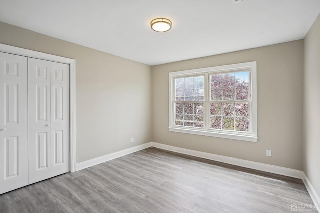431-431 Garfield Ave, South Plainfield, NJ 07080 - unfurnished bedroom featuring wood finished floors and a closet
