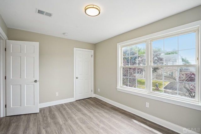 431-431 Garfield Ave, South Plainfield, NJ 07080 - unfurnished bedroom featuring baseboards and light wood-type flooring