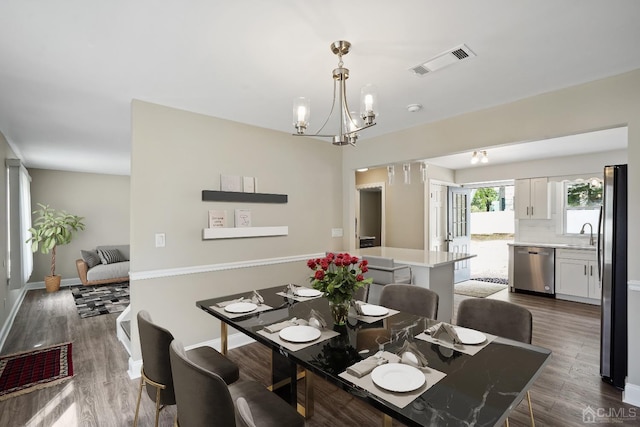 431-431 Garfield Ave, South Plainfield, NJ 07080 - dining area featuring a chandelier and dark wood-style floors