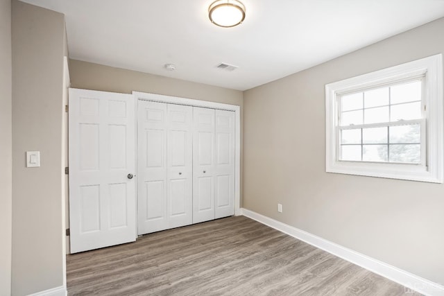 431-431 Garfield Ave, South Plainfield, NJ 07080 - unfurnished bedroom featuring wood finished floors and a closet