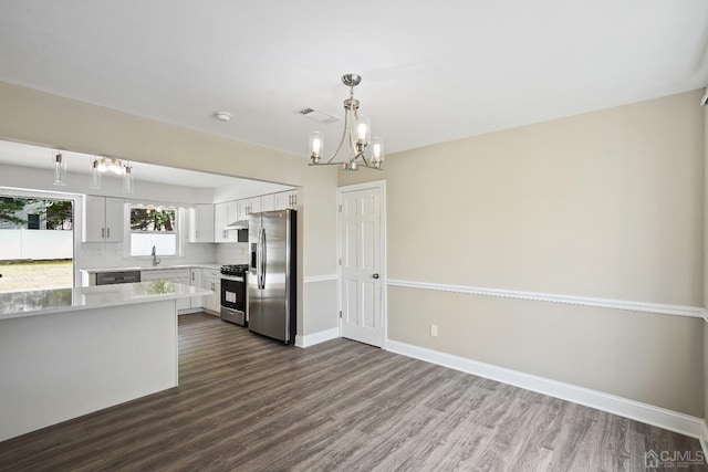 431-431 Garfield Ave, South Plainfield, NJ 07080 - kitchen featuring stainless steel appliances, a chandelier, dark wood-style flooring, light countertops, and white cabinets