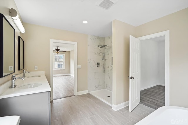 431-431 Garfield Ave, South Plainfield, NJ 07080 - bathroom with double vanity, wood finish floors, a marble finish shower, recessed lighting, and a freestanding tub