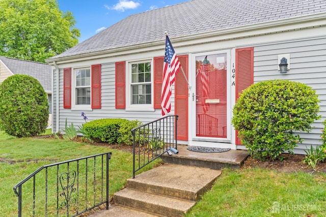 104 Glenwood Ln Unit A, Monroe, NJ 08831 - doorway to property featuring a yard and a shingled roof