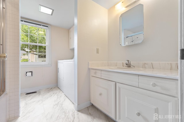 104 Glenwood Ln Unit A, Monroe, NJ 08831 - bathroom with baseboards, marble finish flooring, vanity, and washer / dryer