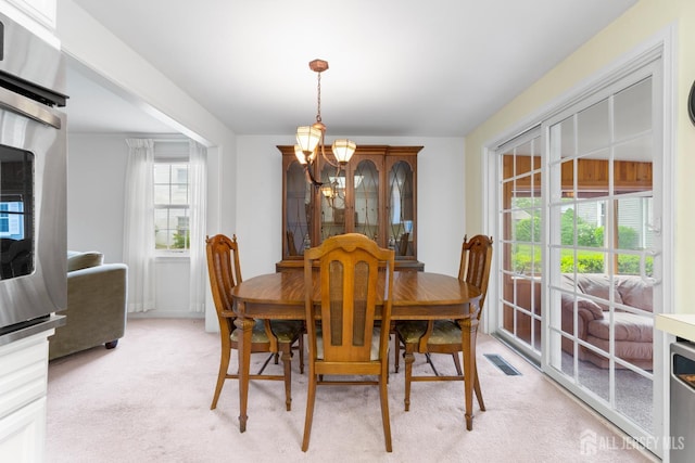 104 Glenwood Ln Unit A, Monroe, NJ 08831 - dining area featuring a chandelier and light colored carpet