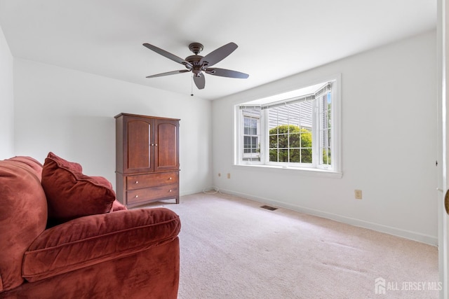 104 Glenwood Ln Unit A, Monroe, NJ 08831 - sitting room with baseboards, a ceiling fan, and light colored carpet